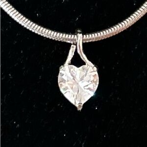 Faux diamond heart shaped silver pendant. 3/8” W, 3/8” D, 3/4” L. Pendan…